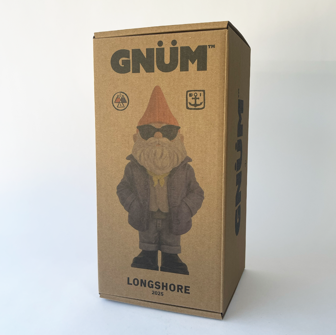 Cardboard box with a gnomes design and 'Gnüm' branding on a craft background